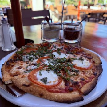 Enzo's Bistro and Bar - Margherita pizza. While not traditional, I implore you to try their pizza for the crust. There's a uniquely delicious flavor to it. - Italian Near Me - La Quinta, California Enzo's Bistro and Bar - Margherita pizza. While not traditional, I implore you to try their pizza for the crust. There's a uniquely delicious flavor to it. - Italian Near Me - La Quinta, California