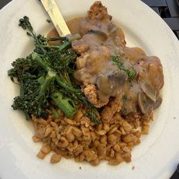 Fried chicken with mushroom gravy, broccolini and spatzel Fried chicken with mushroom gravy, broccolini and spatzel
