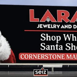 Seiz Sign Company - Large-format promotional banner for Lara's Jewelry and Design featuring seasonal advertising graphics and retail marketing si...