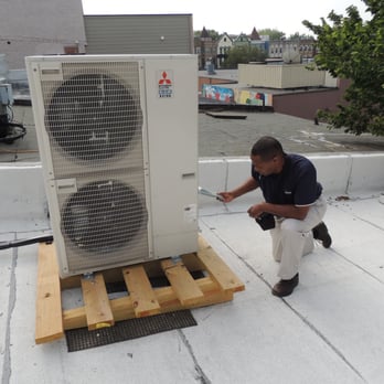 Home Survey Co. - inspecting roof-top compressor unit - Home Inspectors Near Me - Washington, DC, District of Columbia