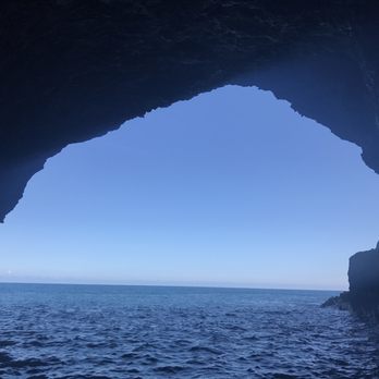 Na Pali Experience - View from inside an ocean cave. - Boating Near Me - Kekaha, Hawaii Na Pali Experience - View from inside an ocean cave. - Boating Near Me - Kekaha, Hawaii
