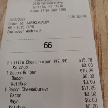 Five Guys - Tab - A paper receipt from Five Guys restaurant located at 26336 Delaware Ave, Buffalo, NY, dated December 2, 2023, at 5:30 PM. It details orders including cheeseburgers, bacon burger, and toppings, with prices and quantities. The receipt includes store and employee information and a phone number. - Burgers Near Me - Buffalo, New York