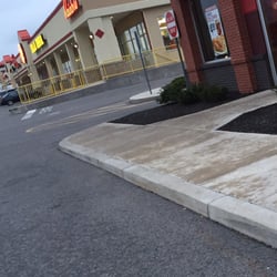 KFC - Strip mall next door and part of front entrance