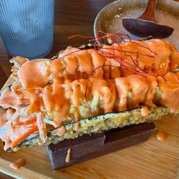 Taco Ebi (Tempura Shrimp) - Deep fried seaweed battered shell, lettuce, carrots, cucumbers and spicy mayo sauce. Taco Ebi (Tempura Shrimp) - Deep fried seaweed battered shell, lettuce, carrots, cucumbers and spicy mayo sauce.