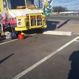 a taco truck parked in a parking lot