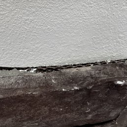 Drywall work done horribly with fencing shown and he dripped white paint everywhere Drywall work done horribly with fencing shown and he dripped white paint everywhere