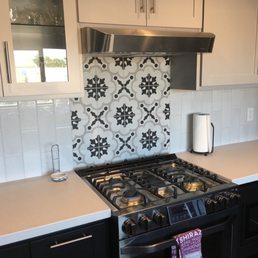 Two different tiles installed and they did an amazing job maximizing the space behind the stove to make my stove the focal point!