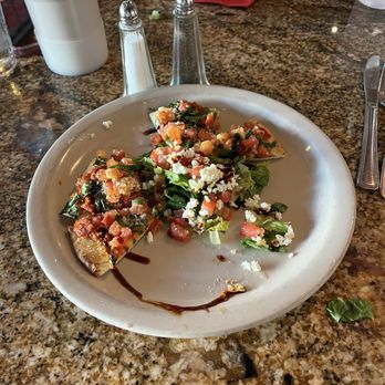 Farina's Winery & Cafe - Bruschetta. We had taken a few pieces before I got the picture. - Italian Near Me - Grapevine, Texas Farina's Winery & Cafe - Bruschetta. We had taken a few pieces before I got the picture. - Italian Near Me - Grapevine, Texas