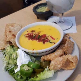 Chavez Mexican Cafe - Queso with ground beef served with chicharon delicious - Mexican Near Me - Houston, Texas