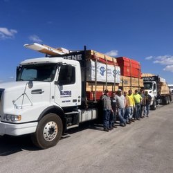 Dufrene Building Materials - Our friendly, knowledgeable, and hardworking staff in Pensacola, FL with a delivery truck for job site delivery - Dufrene Building Materials