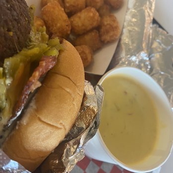 Redheaded Stranger - Green chili cheeseburger, spiced tots, queso. - Tacos Near Me - Nashville, Tennessee Redheaded Stranger - Green chili cheeseburger, spiced tots, queso. - Tacos Near Me - Nashville, Tennessee