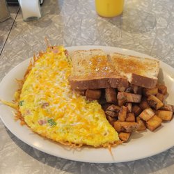 Scrambled Sam's - Western omelet (didn't need to add an ounce of salt!), potatoes and wheat toast. Orange juice tastes like fresh squeezed, might be.