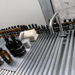 Aesop Stanford - Sink lined with Aesop products where I tried cleanser on the back of my hand