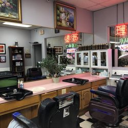 Gui Gong Ja Barber Shop - View of 2/4 of the barber stations, rather professional setup, full service equipment, fountain, &mini TVs, plus things for sale. (3/5/2018)