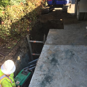 C2R Engineering - a construction worker working on a trench - General Contractors Near Me