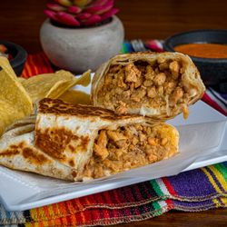 TBK Grill - Grilled chicken burrito stuffed with rice, beans, cheese, and our house-seasoned flavors - wrapped and toasted to perfection.
