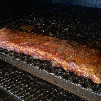 Baker's Ribs - a piece of meat cooking on a grill - Barbeque Near Me - Eden Prairie, Minnesota Baker's Ribs - a piece of meat cooking on a grill - Barbeque Near Me - Eden Prairie, Minnesota
