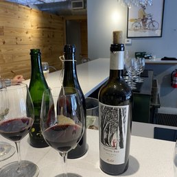 three bottles of wine and three glasses of wine three bottles of wine and three glasses of wine