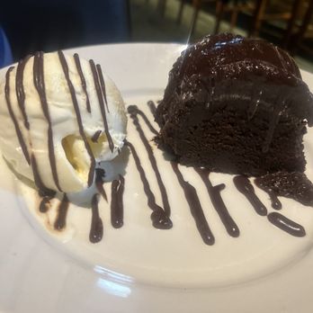 J. Alexander's - Chocolate ganache cake and scoop of vanilla ice cream - New American Near Me - Livonia, Michigan J. Alexander's - Chocolate ganache cake and scoop of vanilla ice cream - New American Near Me - Livonia, Michigan