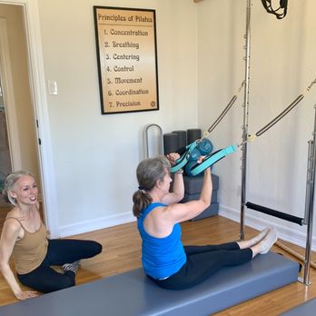 Vero Pilates - Vero Pilates instructor teaching an arm spring series to a member using the Wall Unit. - Pilates Near Me - Long Beach, California Vero Pilates - Vero Pilates instructor teaching an arm spring series to a member using the Wall Unit. - Pilates Near Me - Long Beach, California