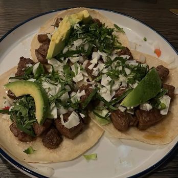 Luchador Micheladas & Botanas - Taco De Carne Asada.  The ribeye was so tender. - Tacos Near Me - Cypress, Texas