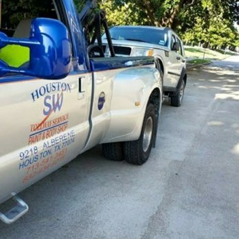 Houston SouthWest Towing - Wheel lift in action. Front wheel drive suv being towed. - Towing Near Me - Houston, Texas Houston SouthWest Towing - Wheel lift in action. Front wheel drive suv being towed. - Towing Near Me - Houston, Texas