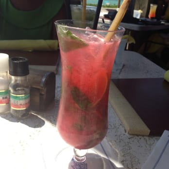 Gumbo Limbo - $14 raspberry mojito with lots of fresh mint and a sugar cane! - Seafood Near Me - Naples, Florida