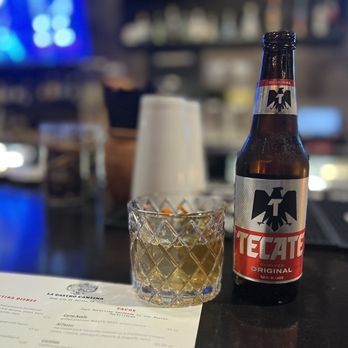 Revolver Taco Lounge - a bottle of beer and a glass - Tacos Near Me - Dallas, Texas Revolver Taco Lounge - a bottle of beer and a glass - Tacos Near Me - Dallas, Texas