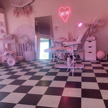 Sorry Mom - the waiting area painted entirely in pink and black and white checkered floor. - Tattoo Near Me - Oakland, California Sorry Mom - the waiting area painted entirely in pink and black and white checkered floor. - Tattoo Near Me - Oakland, California