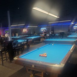 a pool table in a bar a pool table in a bar