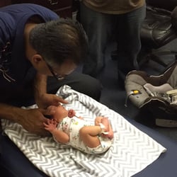 A newborn baby girl getting adjusted to help clear up any subluxations caused during labor.