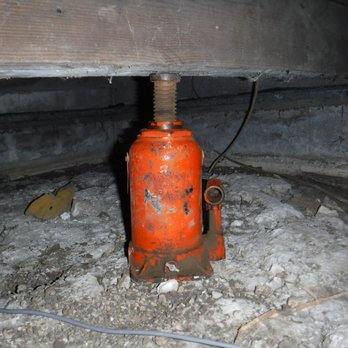 Property Inspection Group - Bottle jack used instead of a pier under a house. Foundation problems found during a home inspection. - Home Inspectors Near Me - Rowlett, Texas Property Inspection Group - Bottle jack used instead of a pier under a house. Foundation problems found during a home inspection. - Home Inspectors Near Me - Rowlett, Texas