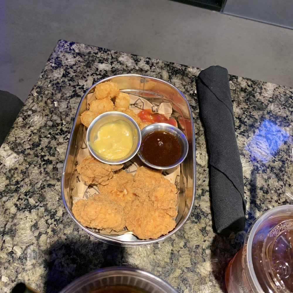 Topgolf - Kids chicken and tots with sauce - Golf Near Me - Independence, Ohio Topgolf - Kids chicken and tots with sauce - Golf Near Me - Independence, Ohio