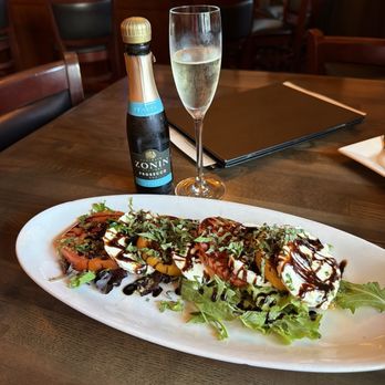 Della Notte - Caprese Salat and prosecco! I hear Italy calling. - Italian Near Me - Annapolis, Maryland Della Notte - Caprese Salat and prosecco! I hear Italy calling. - Italian Near Me - Annapolis, Maryland