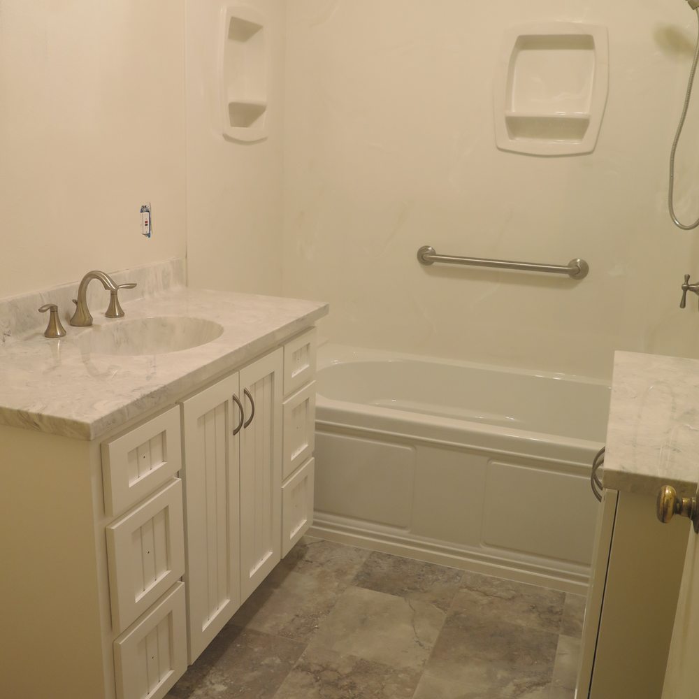 OC Contractor, Inc - Mid-remodel: they installed the bathtub, flooring and cabinets in only 1 week! - General Contractors Near Me
