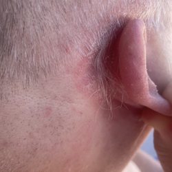 Great Clips - Missed clump of hair behind the right ear.
