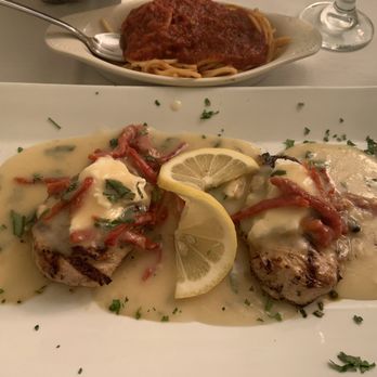 Santioni's Italian Restaurant - Chicken with goat cheese and sun dried tomatoes with a lemon butter sauce. - Italian Near Me - Fleming Island, Florida