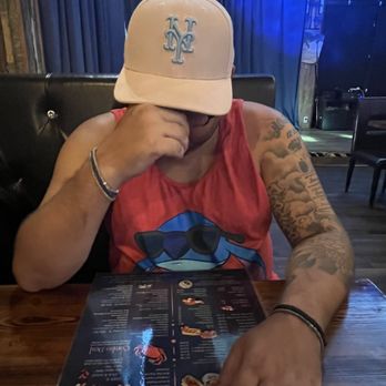 Boil Bay - My husband reading the menu - Seafood Near Me - Virginia Beach, Virginia
