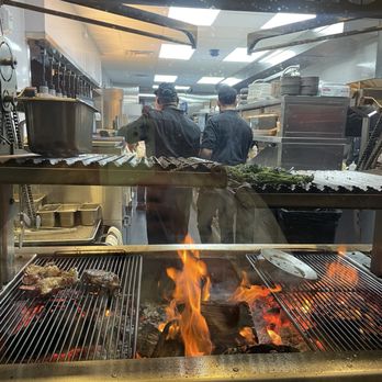Chophouse 285 - Real flame grilling in the open kitchen - Steakhouses Near Me - Englewood, Florida