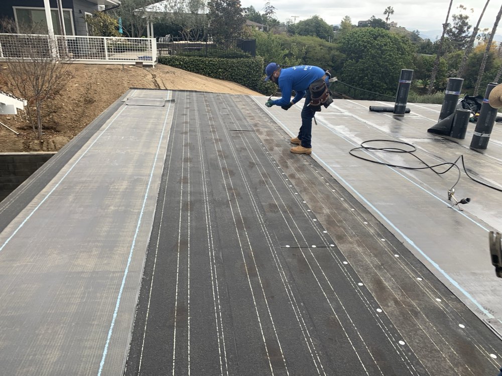 Slide of M G Roofing