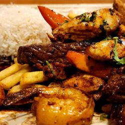 Happy Fish - Tender chicken, flavorful steak, and amazing shrimp in a yummy sauce with French fries and rice.