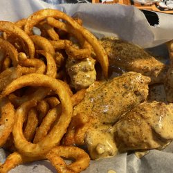 The Coop - Cajun ranch chicken wings with curly fries. Delicious!