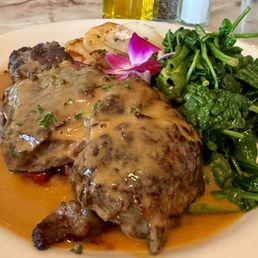 Steak with roasted potatoes and sautéed greens