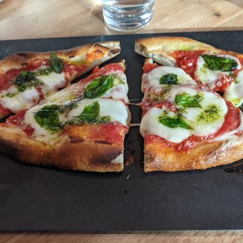 Roger Bar & Restaurant - tomato + mozz, pine nut-basil pesto $14 - New American Near Me - Mountain View, California Roger Bar & Restaurant - tomato + mozz, pine nut-basil pesto $14 - New American Near Me - Mountain View, California