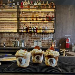Carla's Coffee House - Small sweet potato pie latte with whip cream