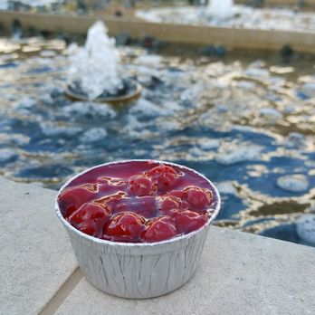 Molly's Cupcakes - a bowl of cherries in front of a fountain - Cupcakes Near Me - Oak Brook, Illinois
