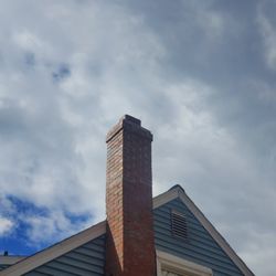 CT Masonry & Construction - Rain cap blew off because it was not securely fastened.