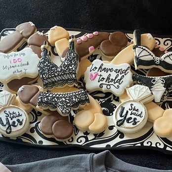 J Cookies - a tray of decorated cookies on a table - Desserts Near Me