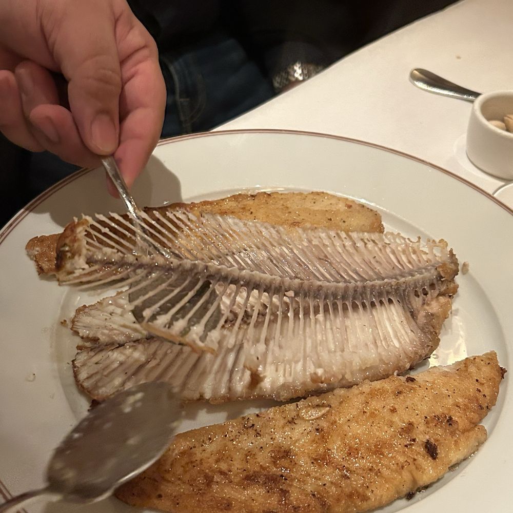 Bouchon Bistro - Deboning Dover sole - French Near Me - Coral Gables, Florida