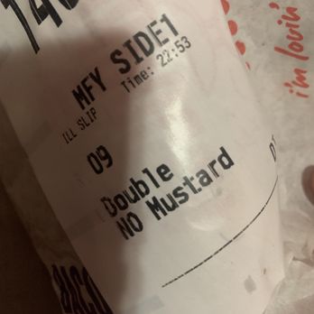McDonald's - a hand holding a donut - Burgers Near Me - Williams, California
